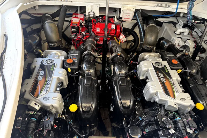 Slide: The Image of Engine compartment of a 2021 Sea Ray Sundancer 350 with twin Horizon engines. - 31