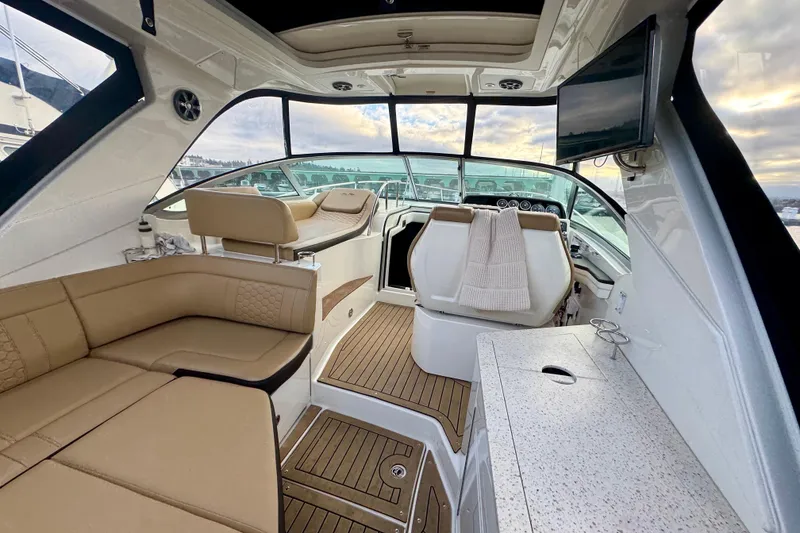 Slide: The Image of Luxurious interior of 2021 Sea Ray Sundancer 350 yacht with plush seating and modern amenities. - 4