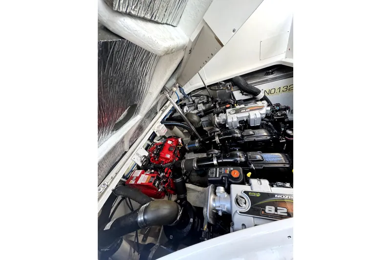 Slide: The Image of Engine compartment of 2021 Sea Ray Sundancer 350, showcasing powerful marine engines. - 40