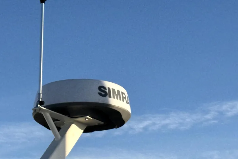 Slide: The Image of Simrad radar on 2021 Sea Ray Sundancer 350 against clear blue sky. - 42