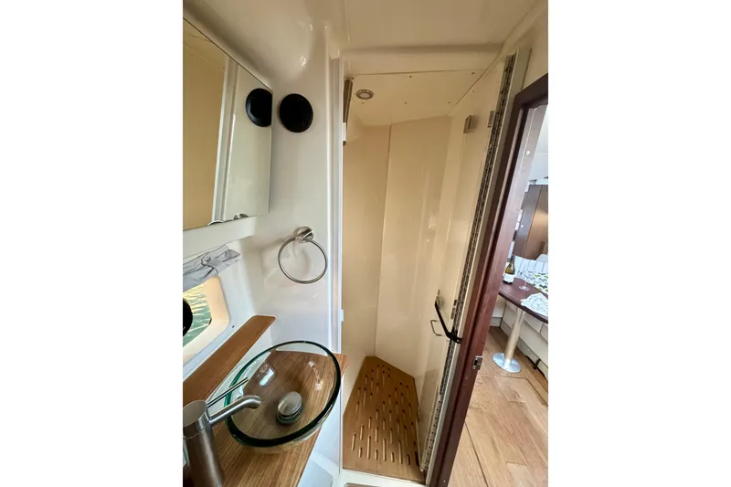 Slide: The Image of 2021 Sea Ray Sundancer 350 bathroom with modern sink and shower. - 9