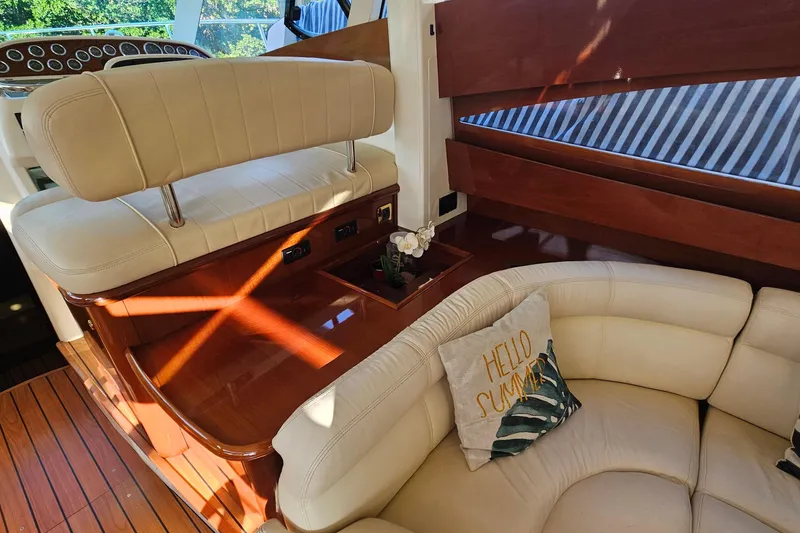 Slide: The Image of Cockpit view of 2005 Prestige 46 yacht with steering wheel and navigation controls. - 19