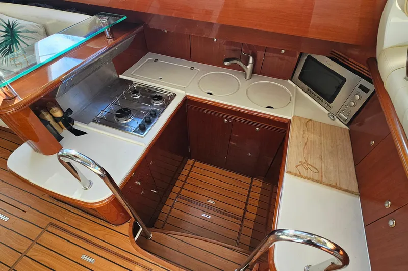 Slide: The Image of Luxurious 2005 Prestige 46 yacht interior with elegant seating and modern dashboard. - 21
