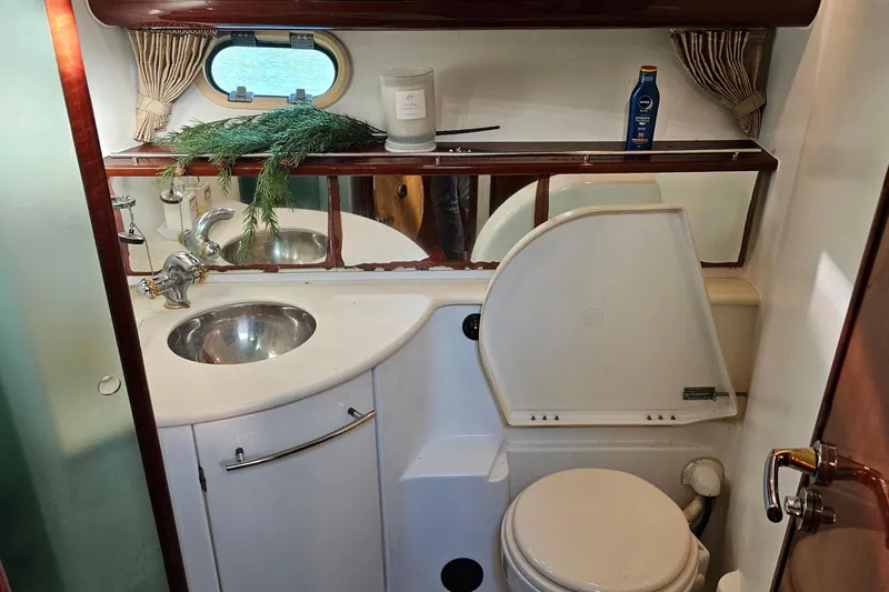 Slide: The Image of Luxurious 2005 Prestige 46 yacht interior with elegant wood finish and modern amenities. - 24