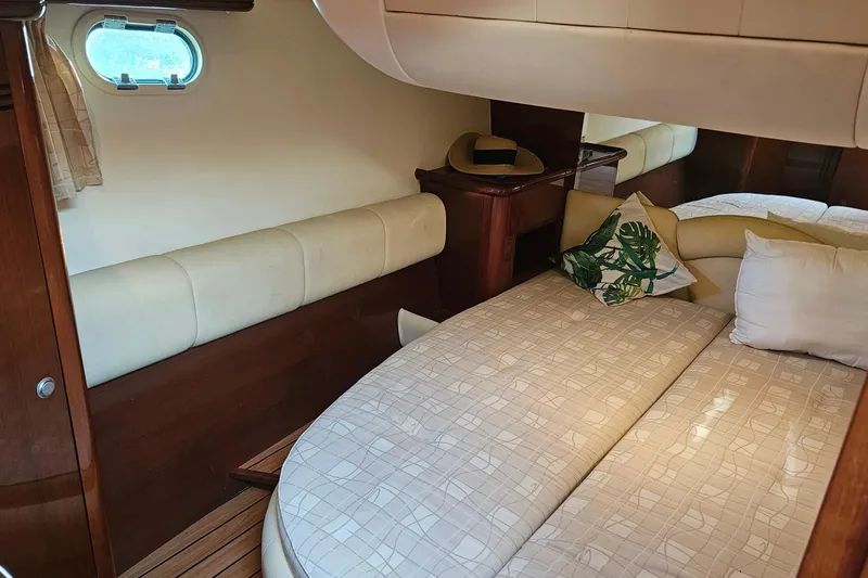 Slide: The Image of Luxurious interior of a 2005 Prestige 46 yacht with elegant seating and wooden accents. - 26