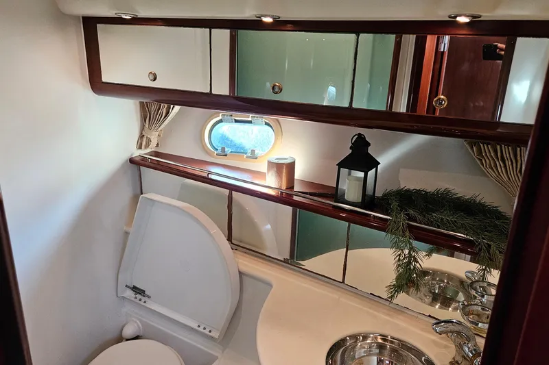 Slide: The Image of Luxurious 2005 Prestige 46 yacht interior with elegant seating and decorative pillows. - 28