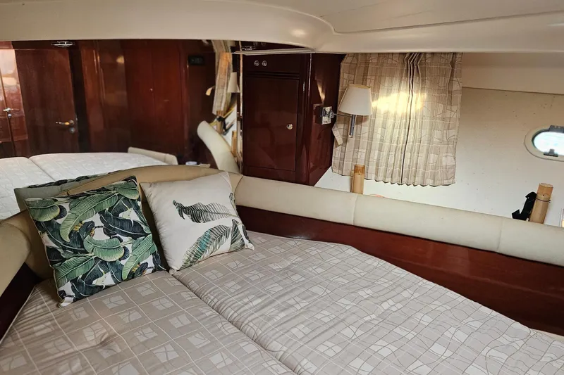 Slide: The Image of Luxurious 2005 Prestige 46 yacht bathroom with sink, mirror, and toilet. - 30