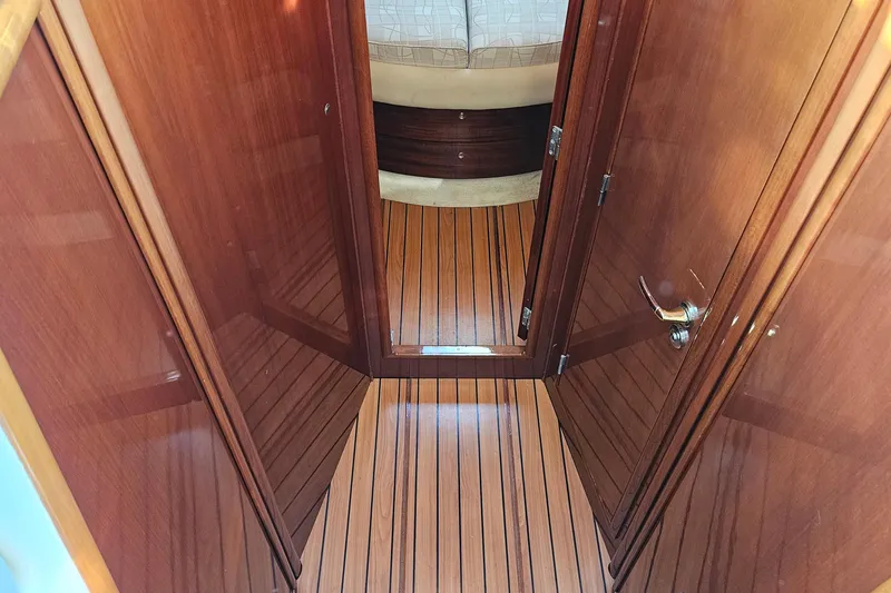 Slide: The Image of Luxurious cabin interior of a 2005 Prestige 46 yacht with elegant bedding and decor. - 33