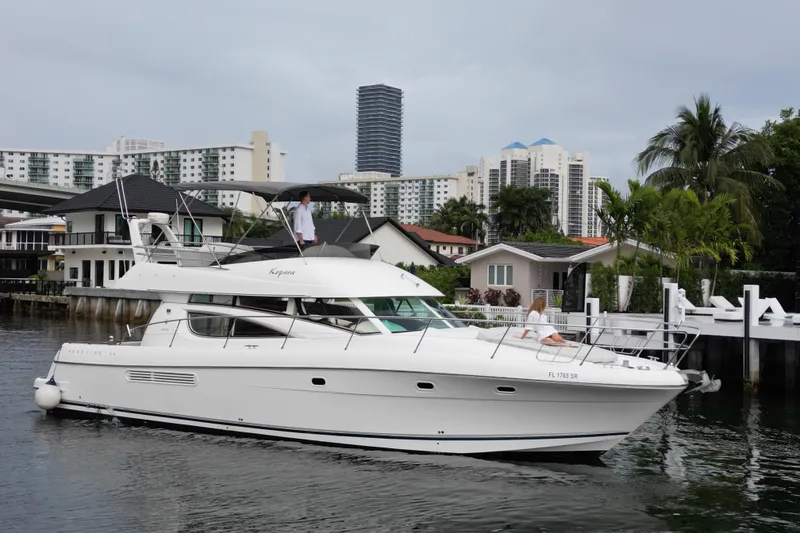 Slide: The Image of Luxurious wooden interior of a 2005 Prestige 46 yacht with elegant stairs and cozy cabins. - 35