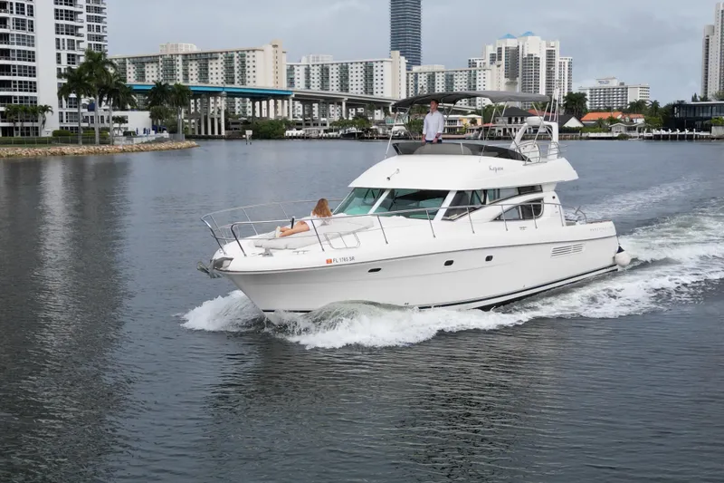 Slide: The Image of Luxurious cabin interior of a 2005 Prestige 46 yacht with elegant bedding and decor. - 36