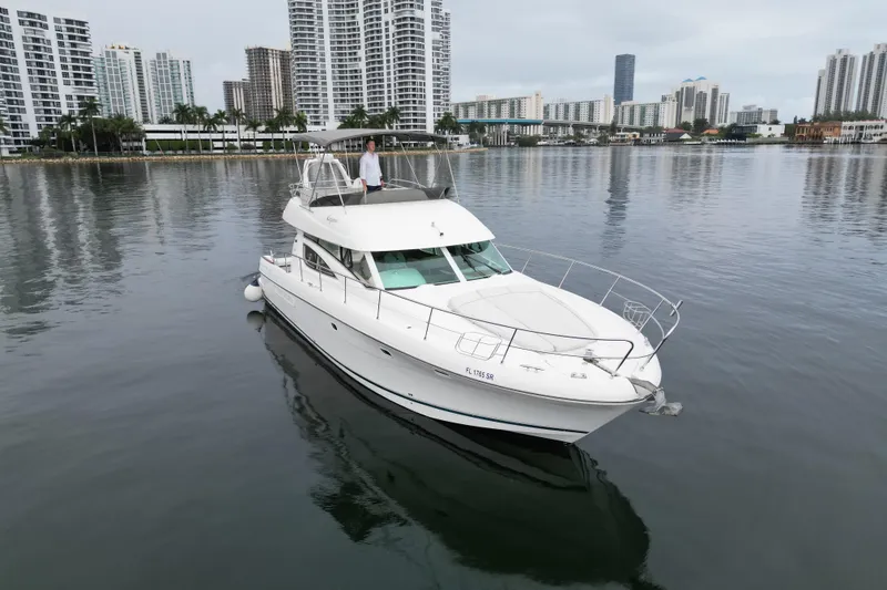 Slide: The Image of Luxurious cabin interior of 2005 Prestige 46 yacht with wood paneling and cozy bedding. - 37