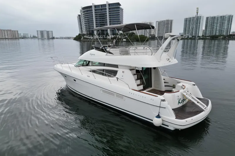 Slide: The Image of Cozy cabin interior of 2005 Prestige 46 yacht with bed and decorative pillow. - 38