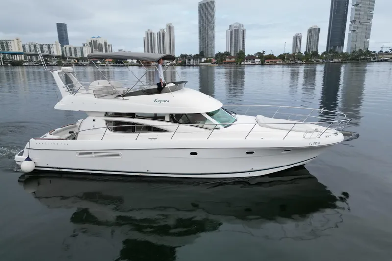 Slide: The Image of Interior of 2005 Prestige 46 yacht with polished wood paneling and flooring. - 39