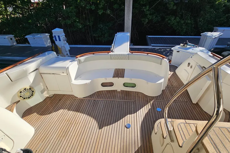 Slide: The Image of Prestige 46 yacht cruising near modern high-rise buildings, 2005 model. - 8