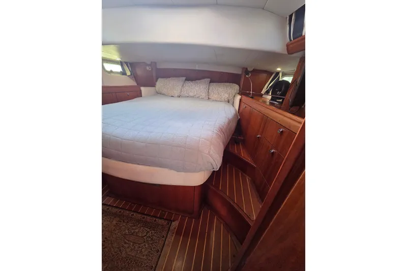 Slide: The Image of Luxurious 1998 Oyster 485 Deck Saloon yacht kitchen with stove, sink, and microwave. - 16
