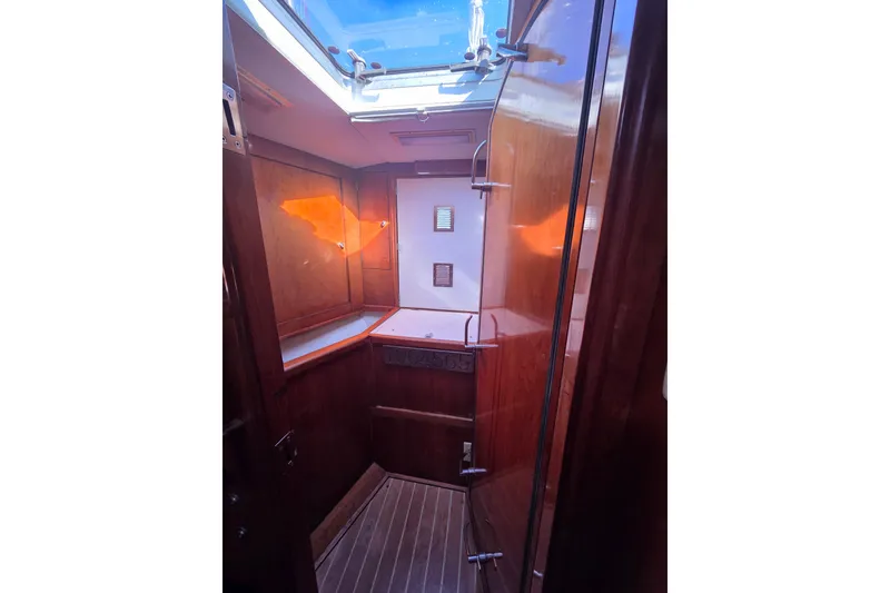 Slide: The Image of Bathroom interior of 1998 Oyster 485 Deck Saloon yacht, featuring sink and mirror. - 24