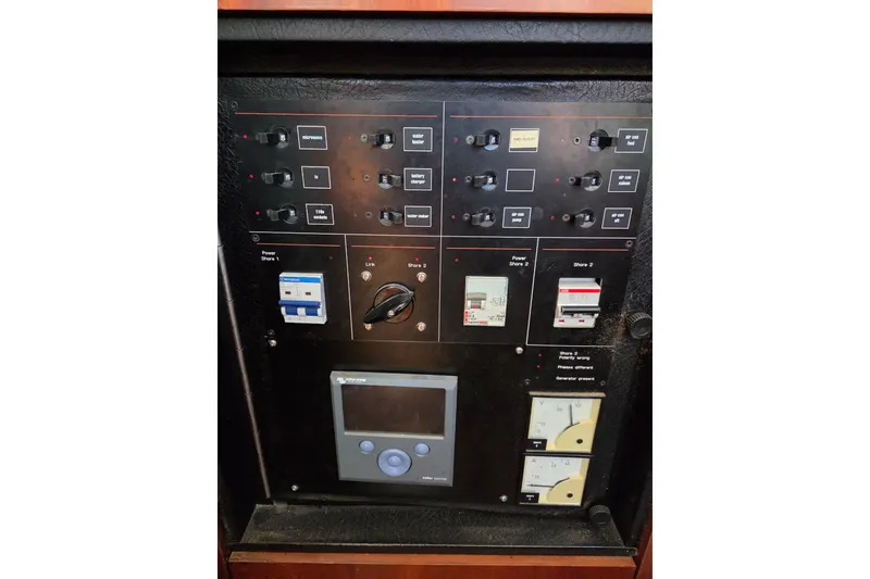 Slide: The Image of Control panel of a 1998 Oyster 485 Deck Saloon with fuel and bilge pump indicators. - 35