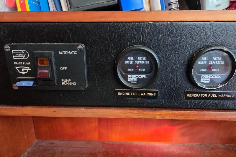 Slide: The Image of Battery compartment of a 1998 Oyster 485 Deck Saloon yacht, showing multiple connected batteries. - 36