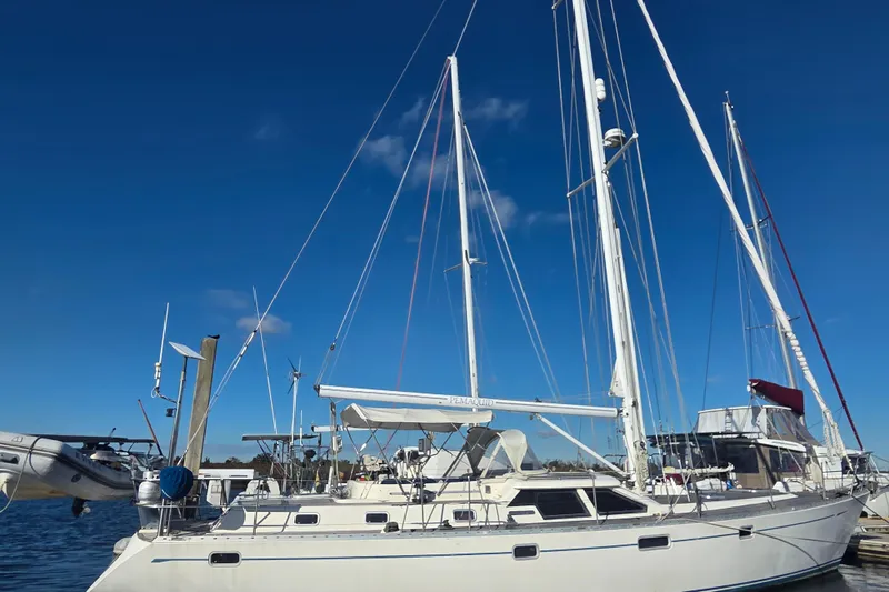 Slide: The Image of Sailing yacht Oyster 485 Deck Saloon, 1998 model, docked under clear blue sky. - 40
