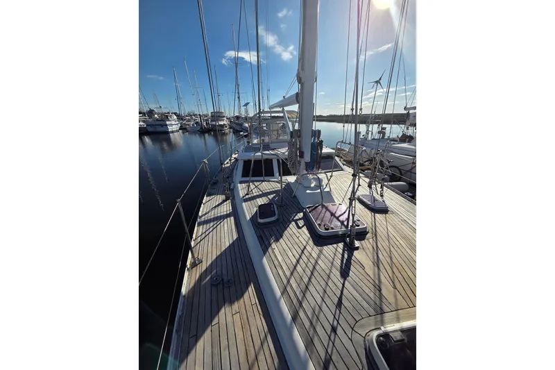 Slide: The Image of Sailing yacht Oyster 485 Deck Saloon, 1998 model, docked at marina under clear sky. - 46
