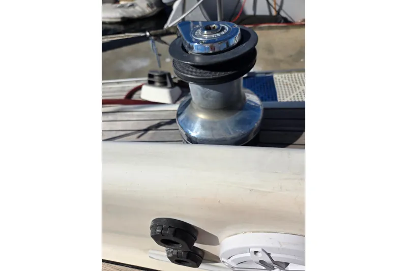 Slide: The Image of Winch on 1998 Oyster 485 Deck Saloon sailboat, docked by the water. - 52