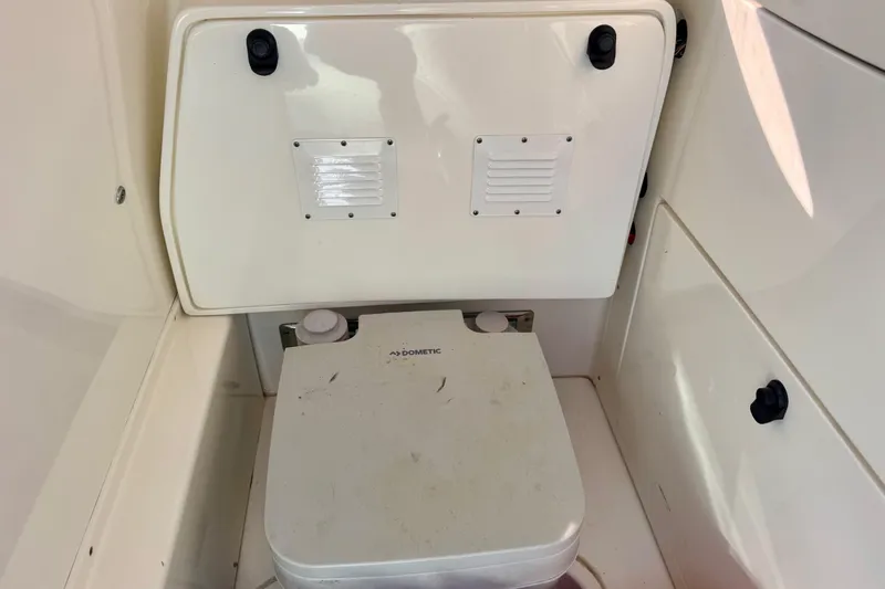 Slide: The Image of 2021 ShearWater 27 Carolina boat interior with Dometic portable toilet. - 10