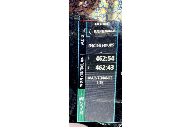 Slide: The Image of Display screen showing engine hours for 2021 ShearWater 27 Carolina boat. - 16
