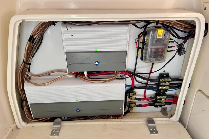 Slide: The Image of Electrical panel of 2021 ShearWater 27 Carolina boat with wiring and components. - 9