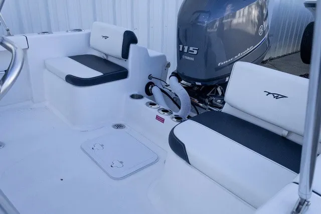 Slide: The Image of The image shows the cockpit of a Tidewater 180 CC Adventure boat with two cushioned seats and a Yamaha engine. - 7