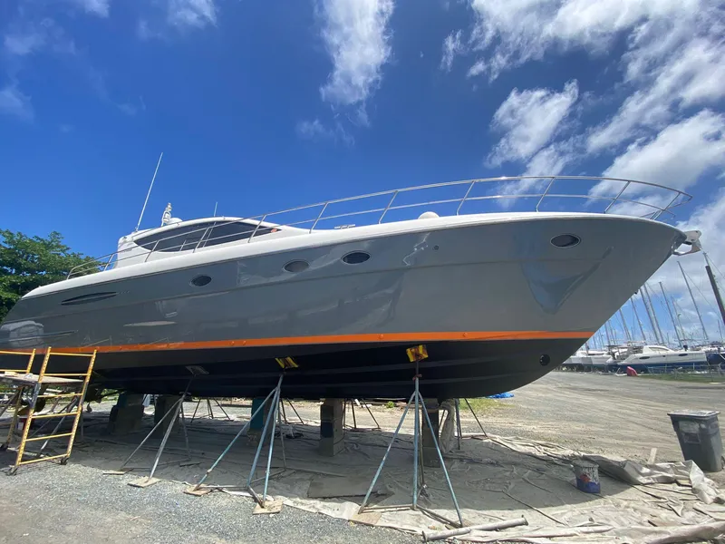 The Image of 2007 Uniesse 54 Sport yacht on dry dock under a clear blue sky. - 0