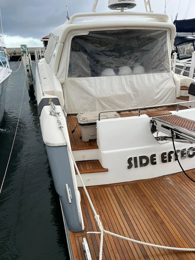 Slide: The Image of 2007 Uniesse 54 Sport yacht docked at marina with teak deck. - 11