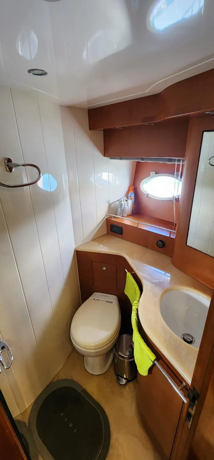Slide: The Image of 2007 Uniesse 54 Sport yacht bathroom with modern fixtures and wooden cabinetry. - 14
