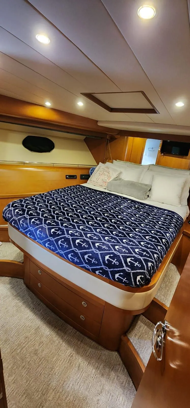 Slide: The Image of Luxurious bedroom in a 2007 Uniesse 54 Sport yacht with cozy bedding. - 15
