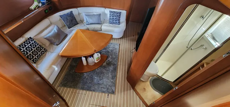 Slide: The Image of Interior of 2007 Uniesse 54 Sport yacht with seating area and bathroom. - 21