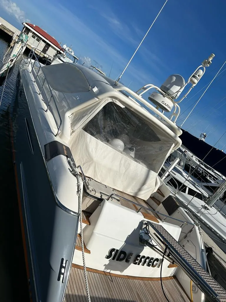 Slide: The Image of 2007 Uniesse 54 Sport yacht docked at a marina. - 7