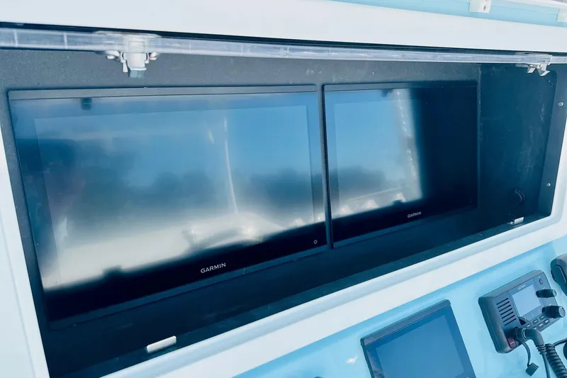 Slide: The Image of Dashboard of 2025 Contender 39 ST with dual Garmin displays. - 12