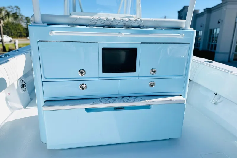 Slide: The Image of 2025 Contender 39 ST boat interior with light blue cabinetry and modern design. - 16