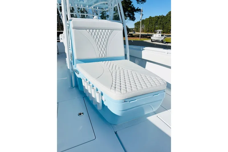 Slide: The Image of 2025 Contender 39 ST boat with elegant white and blue seating, featuring diamond-patterned upholstery. - 22