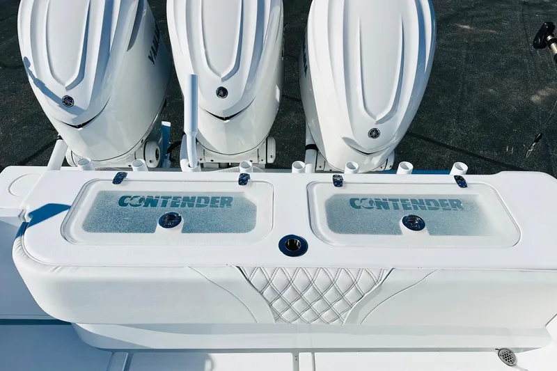 Slide: The Image of 2025 Contender 39 ST boat with triple Yamaha engines and dual livewells. - 25