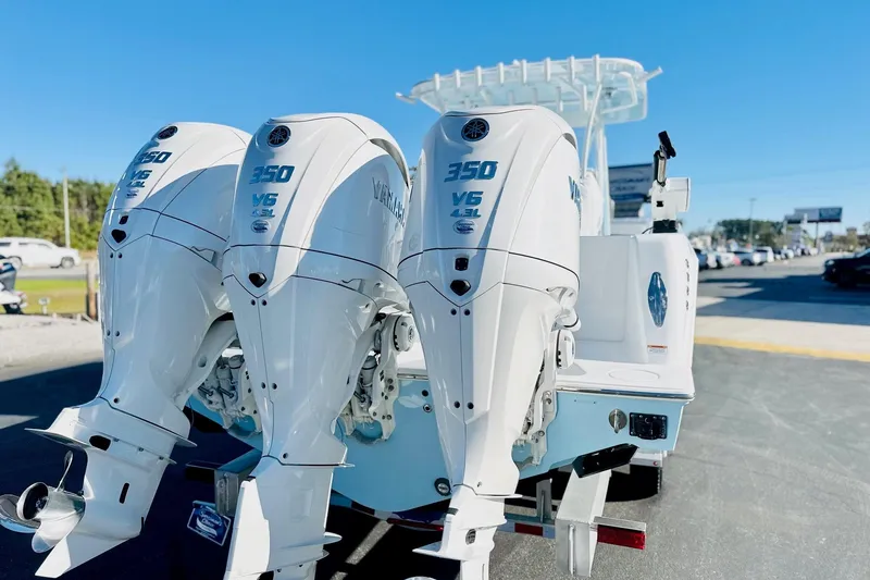 Slide: The Image of 2025 Contender 39 ST boat with triple Yamaha 350 V6 outboard engines. - 27