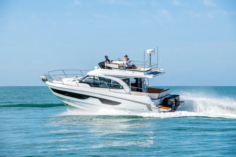 Slide: The Image of 2026 Beneteau Antares 11 cruising on open water under clear skies. - 1