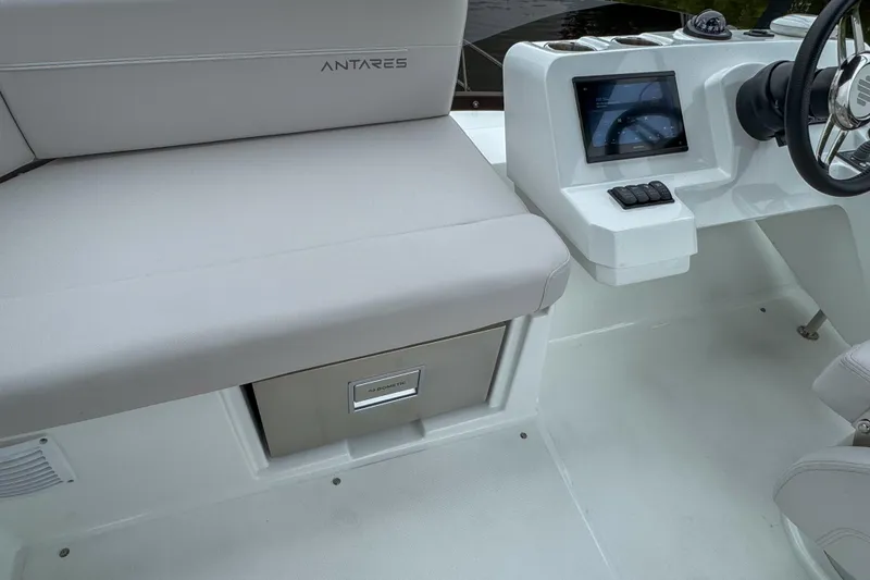 Slide: The Image of Interior of 2026 Beneteau Antares 11 boat with seating and control panel. - 39