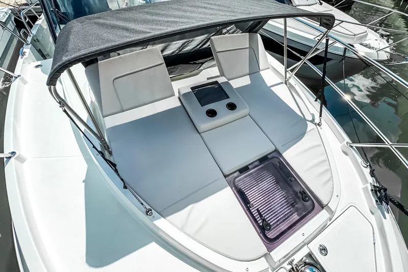 Slide: The Image of 2026 Beneteau Antares 11 boat deck with sunbathing area and canopy. - 42