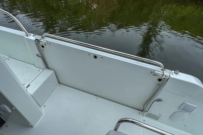 Slide: The Image of 2026 Beneteau Antares 11 boat deck with railing, near calm water. - 46