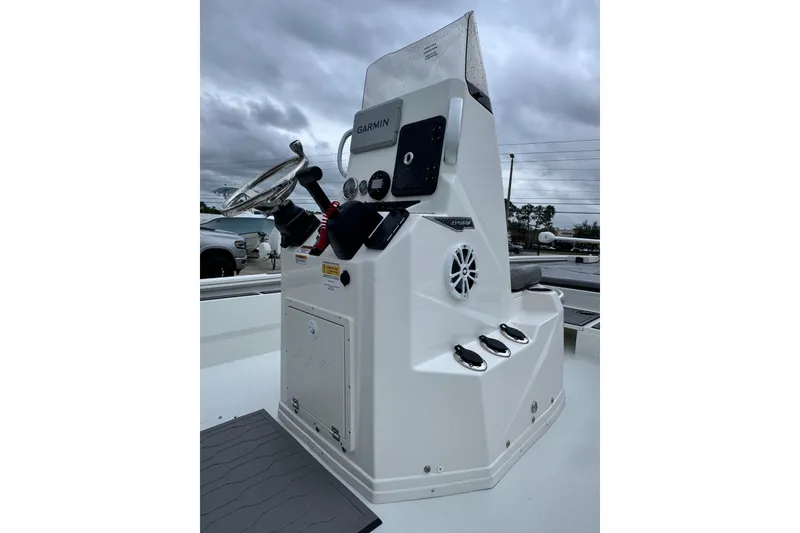 Slide: The Image of Avid 23 Fusion 2026 boat console with Garmin navigation, under cloudy skies. - 10