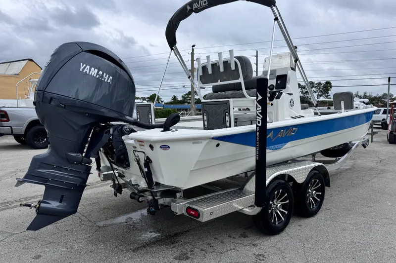 Slide: The Image of 2026 Avid 23 Fusion boat with Yamaha outboard motor on a trailer. - 5