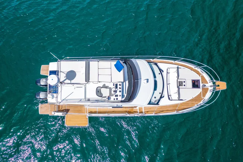 Slide: The Image of Aerial view of 2026 Beneteau Antares 11 yacht on clear blue water. - 3