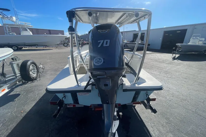 Slide: The Image of 2026 Maverick HPX-17 V boat with 70 HP engine, parked outdoors. - 10