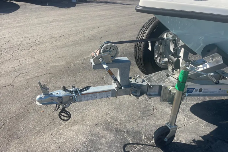 Slide: The Image of Trailer hitch and wheel assembly of a 2026 Maverick HPX-17 V boat. - 11