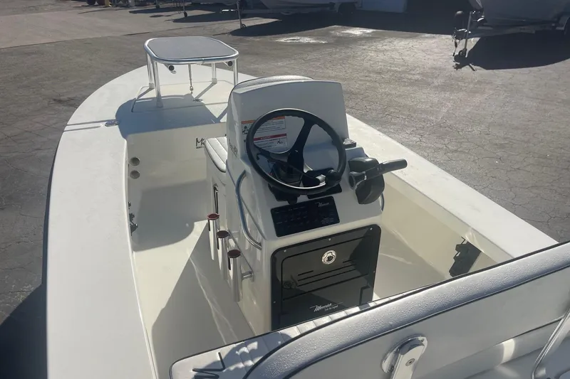 Slide: The Image of 2026 Maverick HPX-17 V boat interior with steering console and seating. - 12